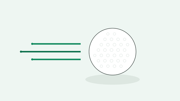 Golfball med fartslinjer som illustrerer svinghastighet